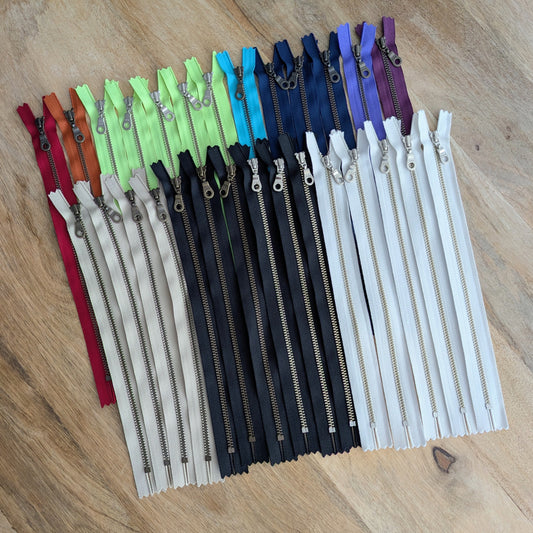 Destash Lot of 28 assorted zippers -- 10" closed-end metal zippers